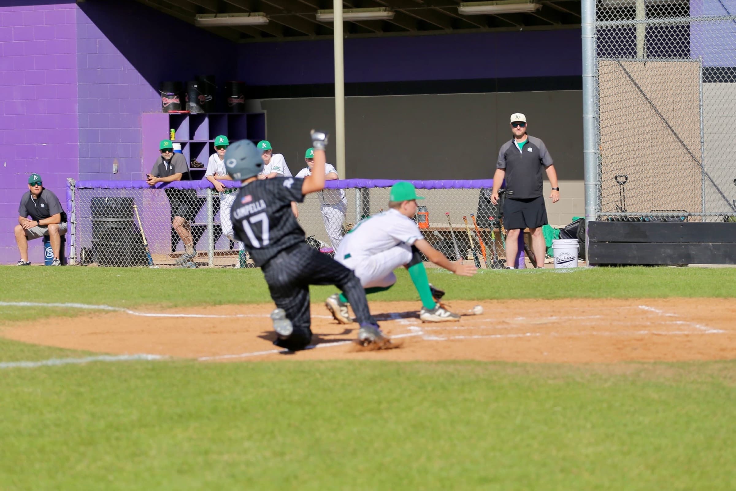 A Ravens runner sliding into home ahead of the tag